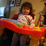 Toshi, you are too big for your exersaucer!